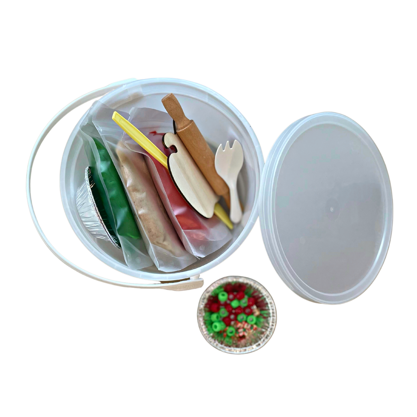 Apple Pie Play Kit comes with 3 colored play doughs, mini wooden rolling pin, trinkets and accessories, as well as custom PlayMat and parent Sense of Help, all in our Play Pail.